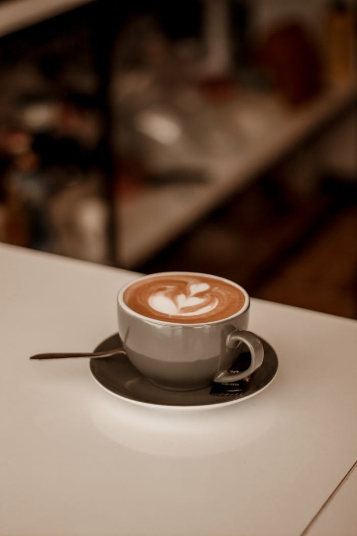 Warm and cozy coffee shop ambiance in Kermanshah with elegant latte art.